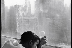 Burt Glinn, Sammy Davis Jr. looking out a Manhattan window at dawn New York, 1959.